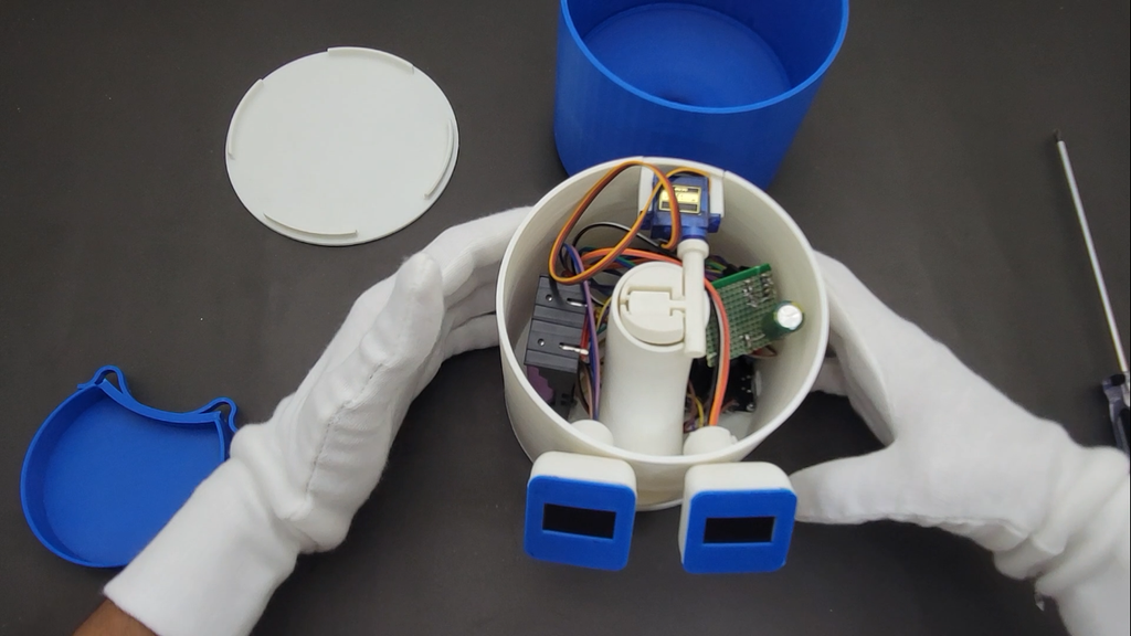 Internal assembly of Automatic pet food Dispenser showing controller, RTC module, servo and power connections